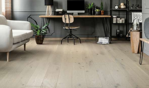  How can choosing slightly darker floors in very bright rooms reduce glare