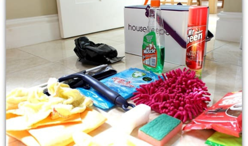 How can keeping a small cleaning caddy ready help you quickly handle surprise guests