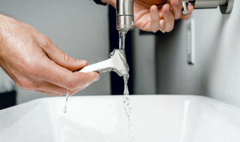 How can noticing slow water flow from a tap early help prevent bigger plumbing issues