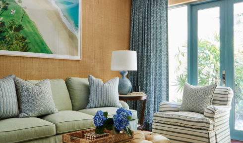 How can painting window trims in a contrasting shade highlight natural light in a room