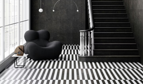 How can placing protective pads under gym or exercise equipment save floors from dents